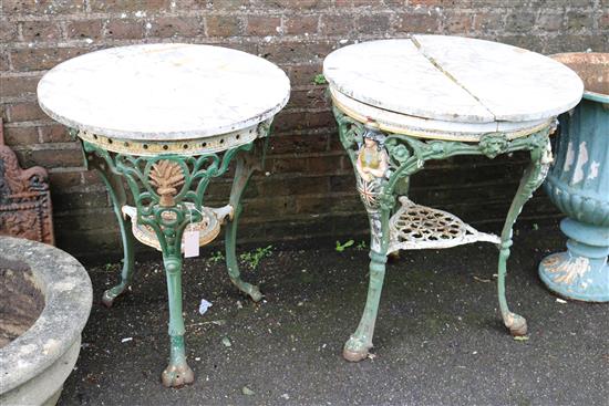 Two Victorian painted cast iron circular topped pub tables